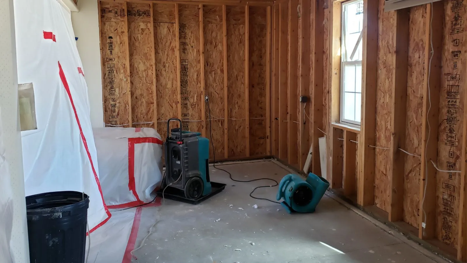 Flooded living room showing what to do after water damage in a residential home